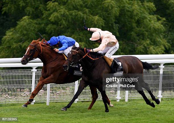 Gravitation ridden by Alan Munro right beats Folk Opera to win the Moet Hennessy Fillies Stakes run at Goodwood Racecourse on July 31 in Goodwood,...