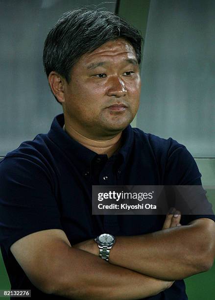 Head coach Kokichi Kimura of Yokohama F Marinos watches his players before the pre season match between Yokohama F Marinos and VfL Bochum at Nissan...