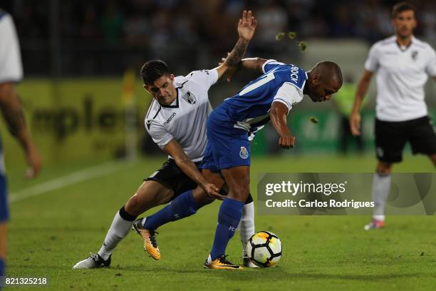 Porto forward Yacine Brahimi from Algeria vies with Vitoria Guimaraes midfielder Guillermo Celis from Colombia during the match between Vitoria...