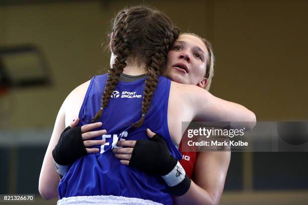 Georgia O'Connor of England and Naomie Pelletier of Canada embrace after the Girls 75kg Gold Medal bout between Georgia O'Connor of England and...