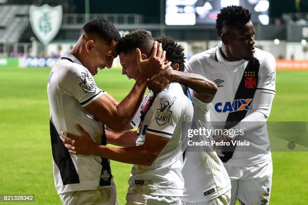 Gilberto and Paulinho of Vasco da Gama celebrate a scored goal against Atletico MG during a match between Atletico MG and Vasco da Gama as part of...