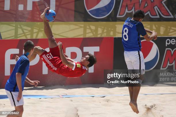 Russia's Romanov vies with France's Francois during the Beach Soccer Mundialito 2017 match between Russia and France at the Carcavelos beach in...