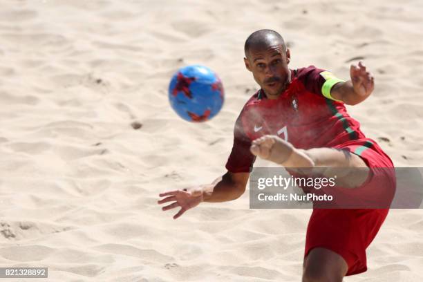 Brazil's defender Bruno Xavier celebrates after scoring a goal during the Beach Soccer Mundialito 2017 match between Portugal and Brazil at the...