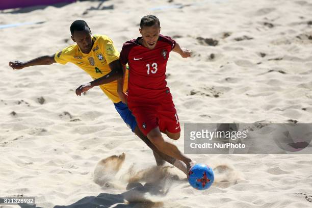 Portugal's midfielder Ricardinho fights for the ball with Brazil's defender Catarino during the Beach Soccer Mundialito 2017 match between Portugal...