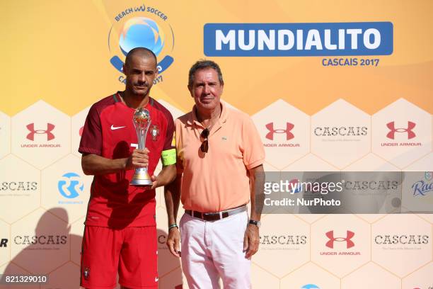 Portugal's forward Madjer raises the 2nd place trophy after the Beach Soccer Mundialito 2017 match between Portugal and Brazil at the Carcavelos...