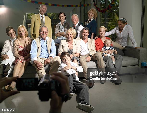 family posing for family video - 12 23 months stock pictures, royalty-free photos & images