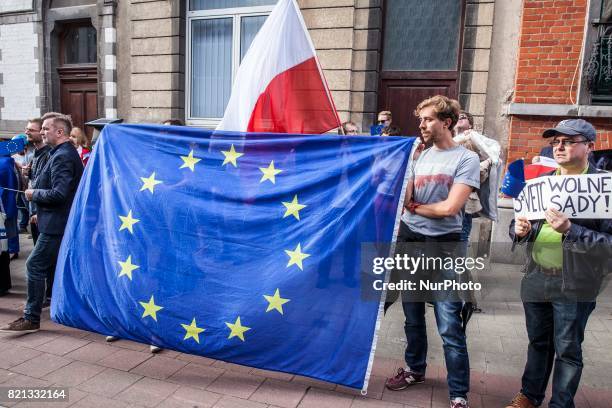 Polish protesters stand in front of the Embassy of Poland in Brussels. The protest takes place to oppose the Polish court reforms on July 23, 2017 in...