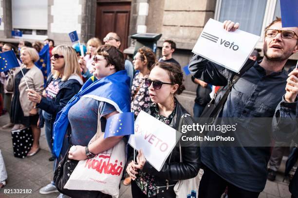 Polish protesters stand in front of the Embassy of Poland in Brussels. The protest takes place to oppose the Polish court reforms on July 23, 2017 in...