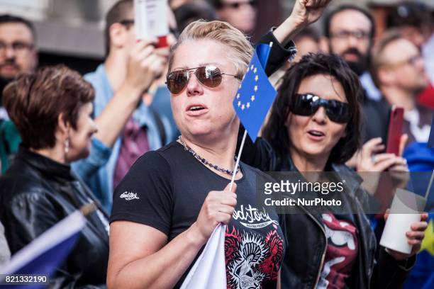 Polish protesters stand in front of the Embassy of Poland in Brussels. The protest takes place to oppose the Polish court reforms on July 23, 2017 in...
