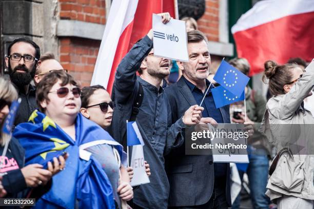 Protester holds a sign that reads 'Wolne Sady' . In opposition to the court reforms in Poland, people protest on July 23, 2017 in Brussels.