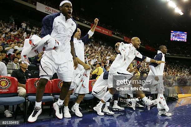 LeBron James, Jason Kidd, Carlos Boozer and Kobe Bryant of USA Basketball Men's Senior National Team celebrate a goal scored against the Turkey...