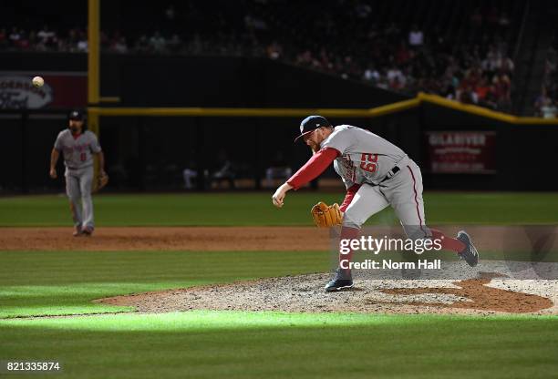 Sean Doolittle of the Washington Nationals delivers a ninth inning pitch against the Arizona Diamondbacks at Chase Field on July 23, 2017 in Phoenix,...
