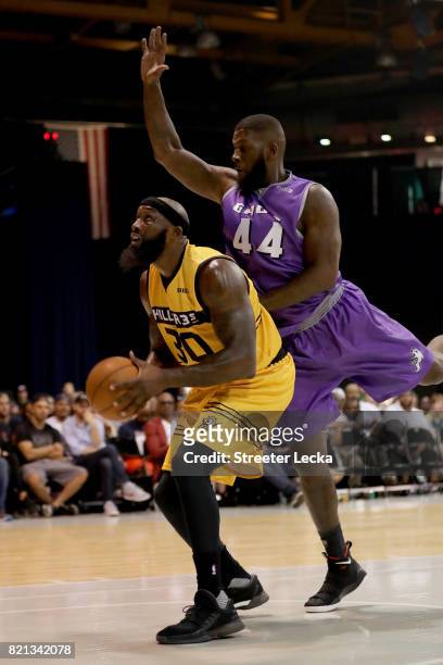 Reggie Evans of the Killer 3s attempts a shot while being guarded by Ivan Johnson of the Ghost Ballers during week five of the BIG3 three on three...