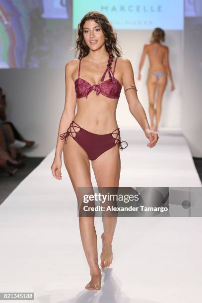 Model walks the runway at SWIMMIAMI Mia Marcelle 2018 Collection at SWIMMIAMI tent on July 23, 2017 in Miami Beach, Florida.