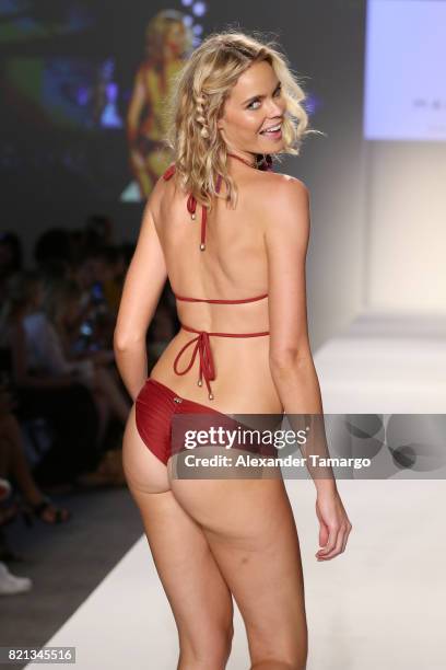 Model walks the runway at SWIMMIAMI Mia Marcelle 2018 Collection at SWIMMIAMI tent on July 23, 2017 in Miami Beach, Florida.