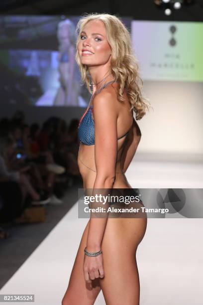 Model walks the runway at SWIMMIAMI Mia Marcelle 2018 Collection at SWIMMIAMI tent on July 23, 2017 in Miami Beach, Florida.