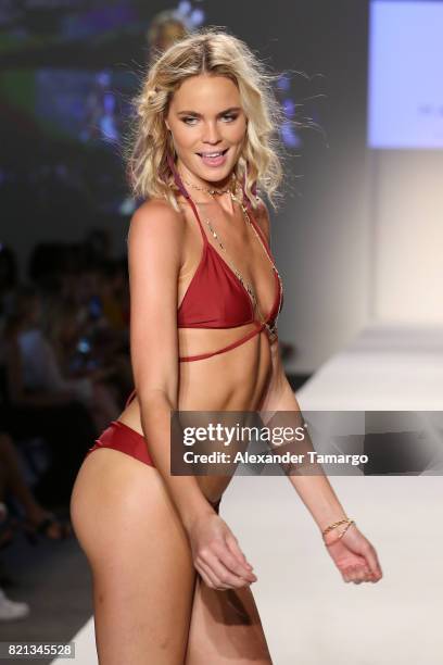 Model walks the runway at SWIMMIAMI Mia Marcelle 2018 Collection at SWIMMIAMI tent on July 23, 2017 in Miami Beach, Florida.