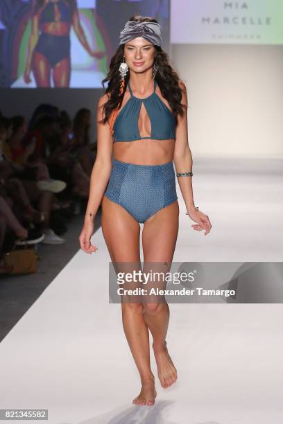 Model walks the runway at SWIMMIAMI Mia Marcelle 2018 Collection at SWIMMIAMI tent on July 23, 2017 in Miami Beach, Florida.