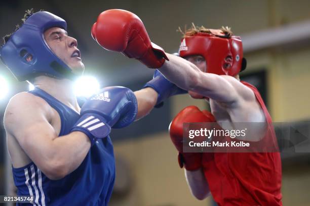 Kane Tucker of Northern Ireland is punched by Aaron Bowen of England as they compete in the Boy's 75 kg Gold Medal bout between Aaron Bowen of...