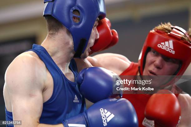 Kane Tucker of Northern Ireland is punched by Aaron Bowen of England as they compete in the Boy's 75 kg Gold Medal bout between Aaron Bowen of...