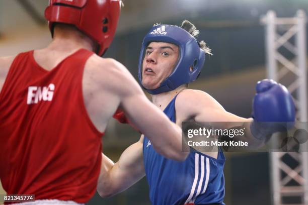 Kane Tucker of Northern Ireland is punched by Aaron Bowen of England as they compete in the Boy's 75 kg Gold Medal bout between Aaron Bowen of...