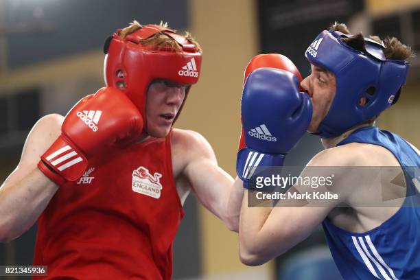 Kane Tucker of Northern Ireland is punched by Aaron Bowen of England as they compete in the Boy's 75 kg Gold Medal bout between Aaron Bowen of...