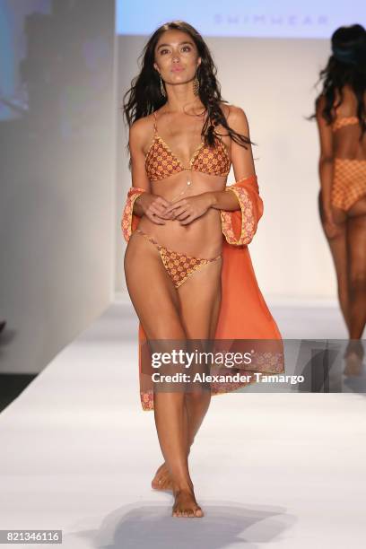 Model walks the runway at SWIMMIAMI Mia Marcelle 2018 Collection at SWIMMIAMI tent on July 23, 2017 in Miami Beach, Florida.