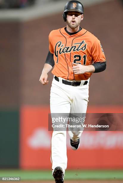 Conor Gillaspie of the San Francisco Giants trots around the bases after hitting a two-run homer against the San Diego Padres in the bottom of the...