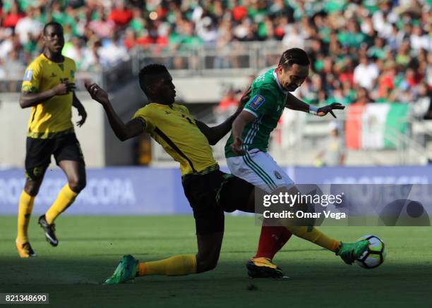 Erick Torres of Mexico competes for the ball with Damion Lowe of Jamaica during a match between Mexico and Jamaica as part of CONCACAF Gold Cup...