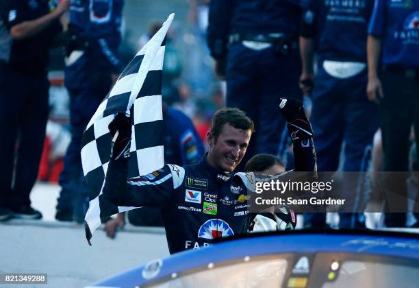 Kasey Kahne, driver of the Farmers Insurance Chevrolet, celebrates winning the Monster Energy NASCAR Cup Series Brickyard 400 at Indianapolis...