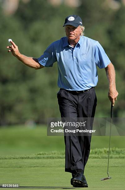 Greg Norman of Australia acknowledges the gallery after his par putt on the second hole during first round of the 2008 U.S. Senior Open Championship...