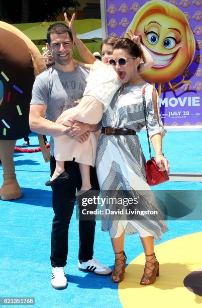 Tess Sanchez, actor Max Greenfield, and Lilly Greenfield attend the premiere of Columbia Pictures and Sony Pictures Animation's "The Emoji Movie" at...