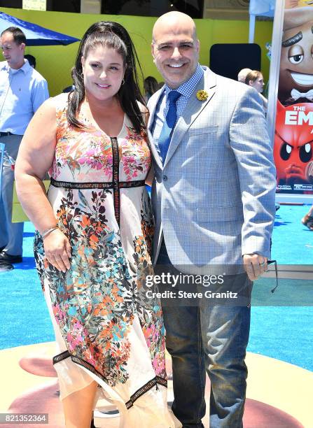 Producer Michelle Raimo Kouyate and director Tony Leondis arrives at the Premiere Of Columbia Pictures And Sony Pictures Animation's "The Emoji...