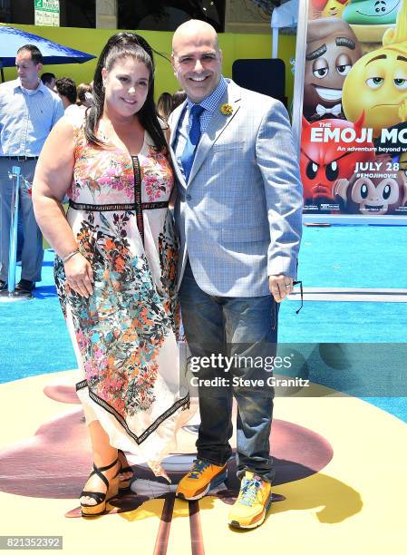 Producer Michelle Raimo Kouyate and director Tony Leondis arrives at the Premiere Of Columbia Pictures And Sony Pictures Animation's "The Emoji...