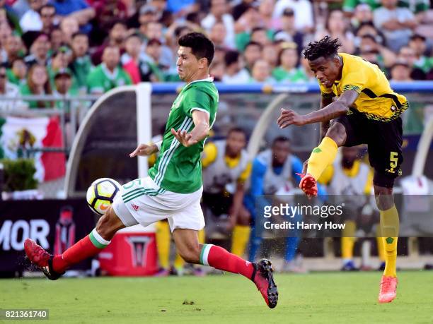 Alvas Powell of Jamaica attempts a shot on Jesus Molina of Mexico lduring a 1-0 Jamaican win in the CONCACAF 2017 semifinal at Rose Bowl on July 23,...