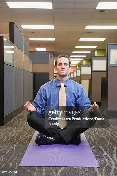 businessman meditating in office - yoga office arab stock pictures, royalty-free photos & images