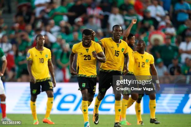 Kemar Lawrence of Jamaica celebrates after scoring the qualifying goal with Je-Vaughn Watson during a match between Mexico and Jamaica as part of...