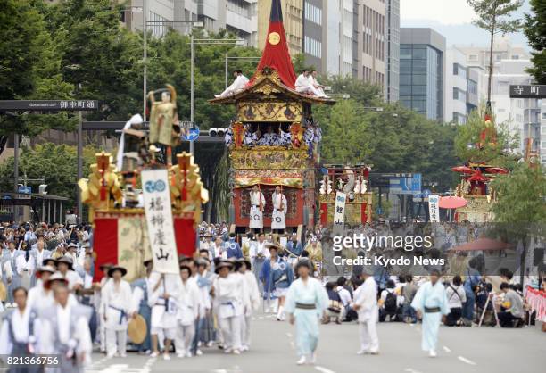 Decorated Yamahoko floats make their way down a street during the traditional Gion Festival in Kyoto on July 24, 2017. The parade has been split into...