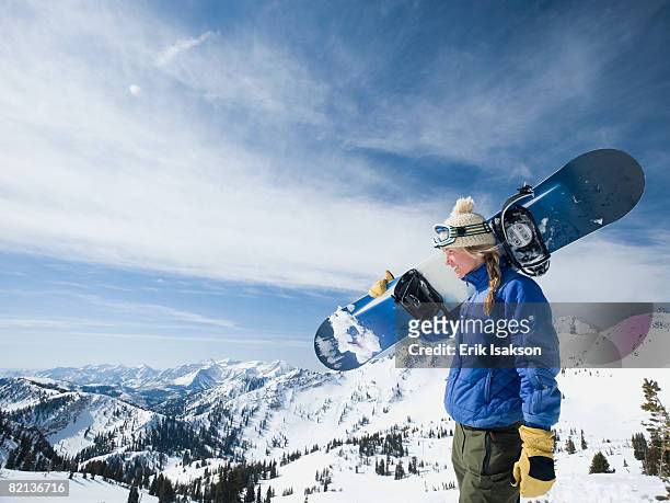 woman holding snowboard, wasatch mountains, utah, united states - women snowboarding stock pictures, royalty-free photos & images
