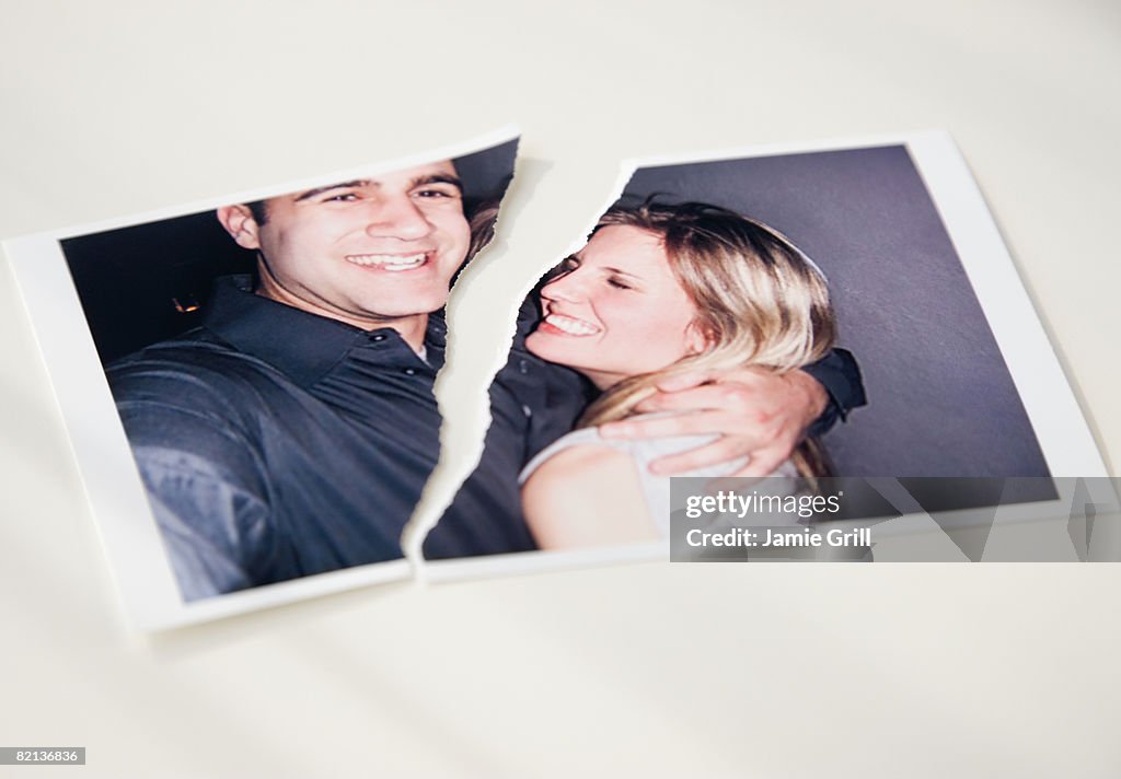 Photograph of couple ripped in half