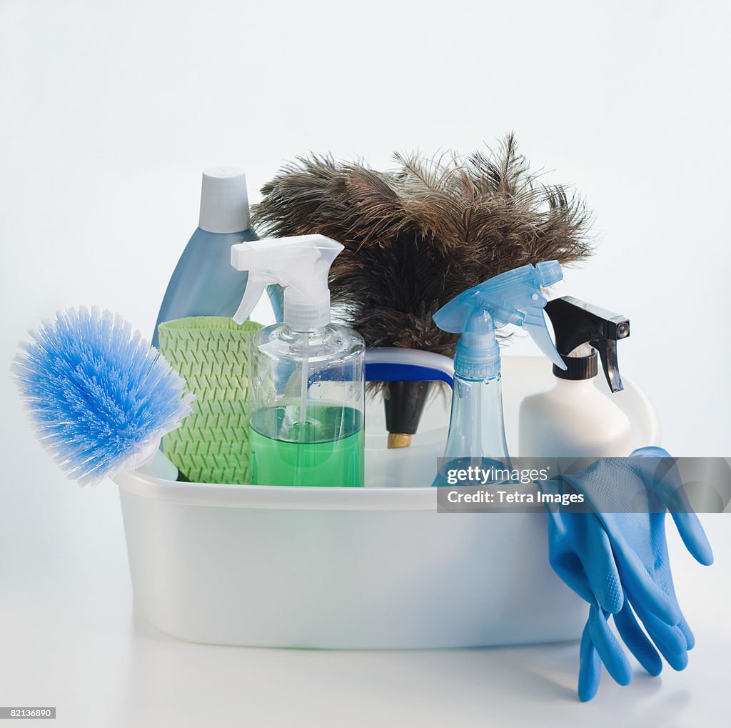 Bin of cleaning products and rubber gloves