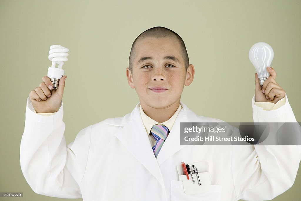 Boy holding light bulbs