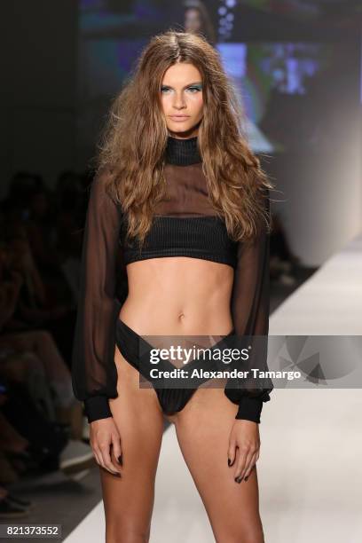Model walks the runway at SWIMMIAMI INDAH 2018 Collection at SWIMMIAMI tent on July 23, 2017 in Miami Beach, Florida.