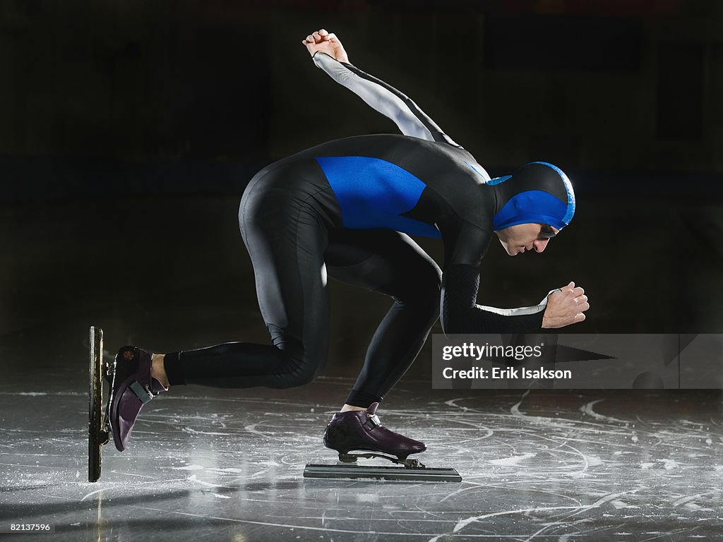Male speed skater on ice
