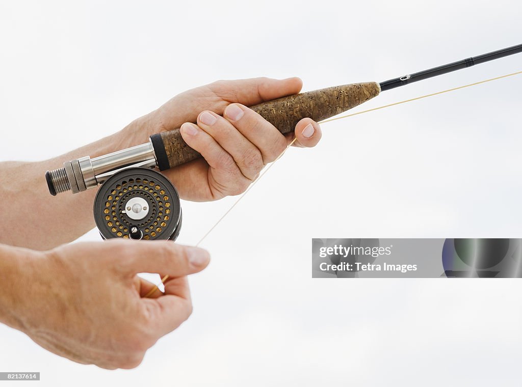 Close up of man fishing rod