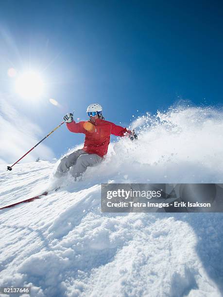 man skiing downhill - alpine skiing downhill stock pictures, royalty-free photos & images