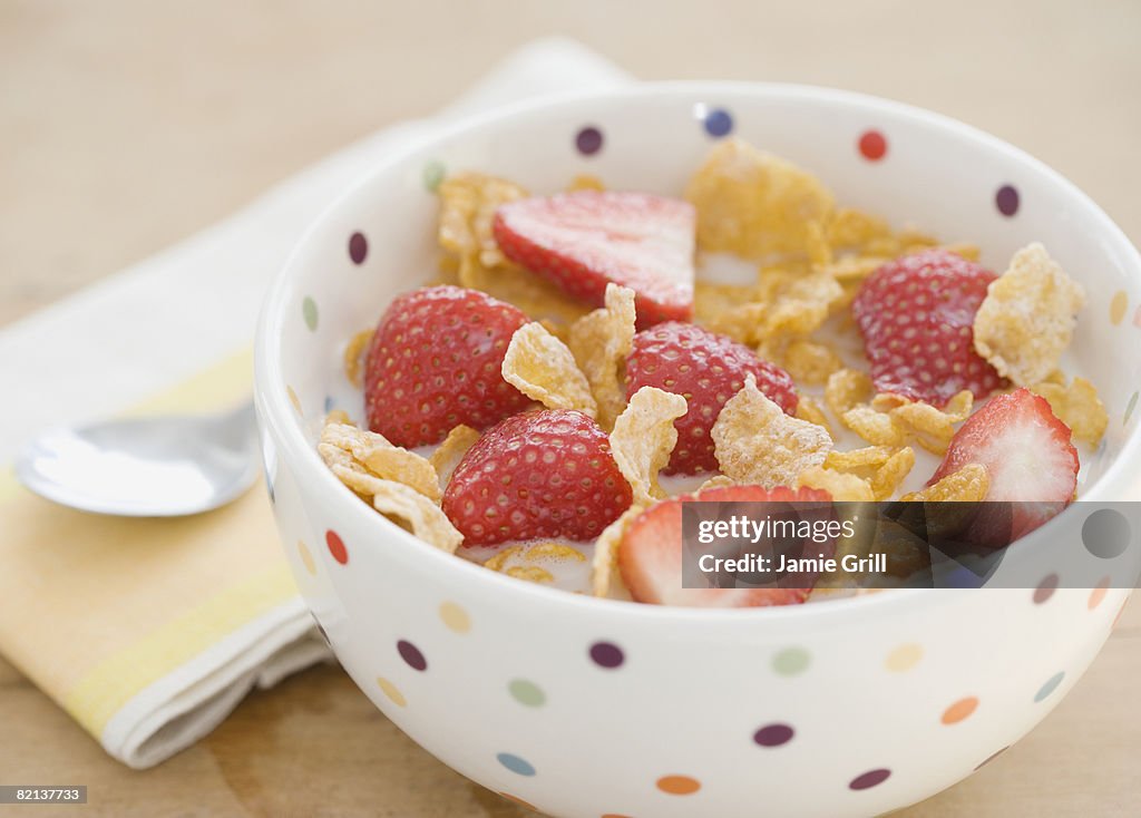 Close up of cereal and strawberries in bowl