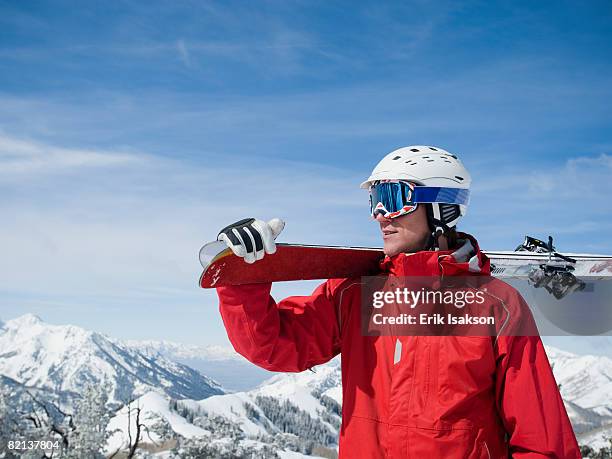 man holding skis on shoulder - wasatch-mountains stockfoto's en -beelden