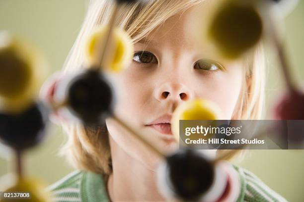 boy looking at molecular model - genius fotografías e imágenes de stock