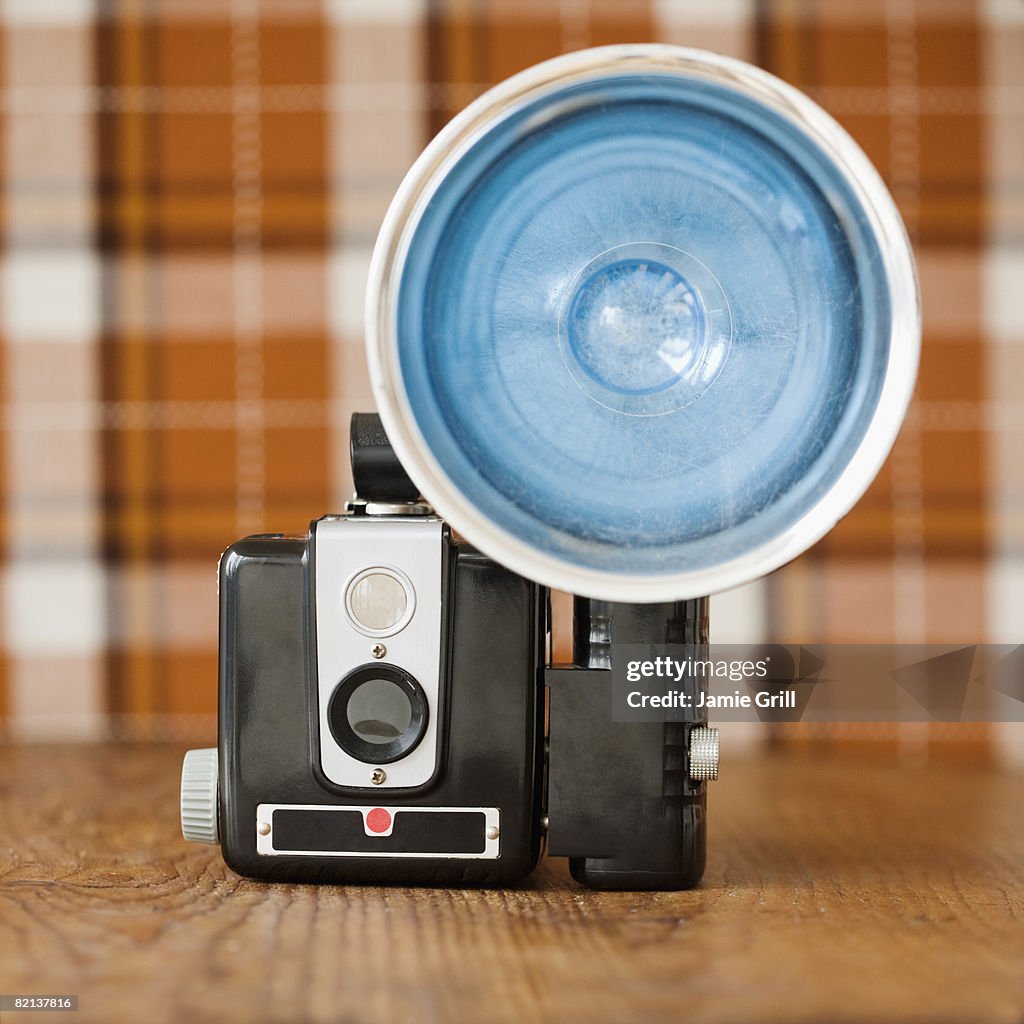 Old fashioned camera on table